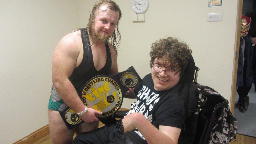 Isaac Wide with wrestler Mike Boar