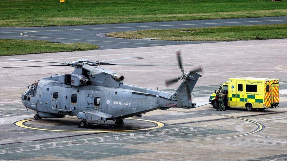 Helicopter and ambulance at RNAS Culdrose after kayaker rescued