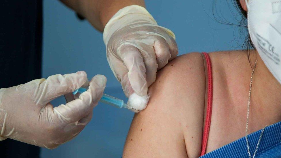 Close up of woman being given Covid vaccine