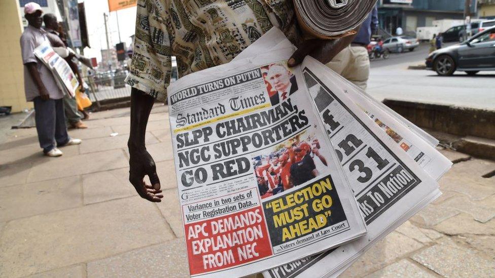 A men sells daliy newspapers on March 27, 2018 in Freetown