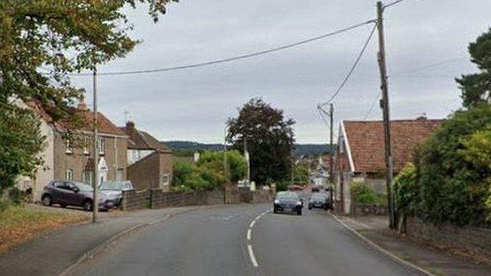 West Town road with houses nearby