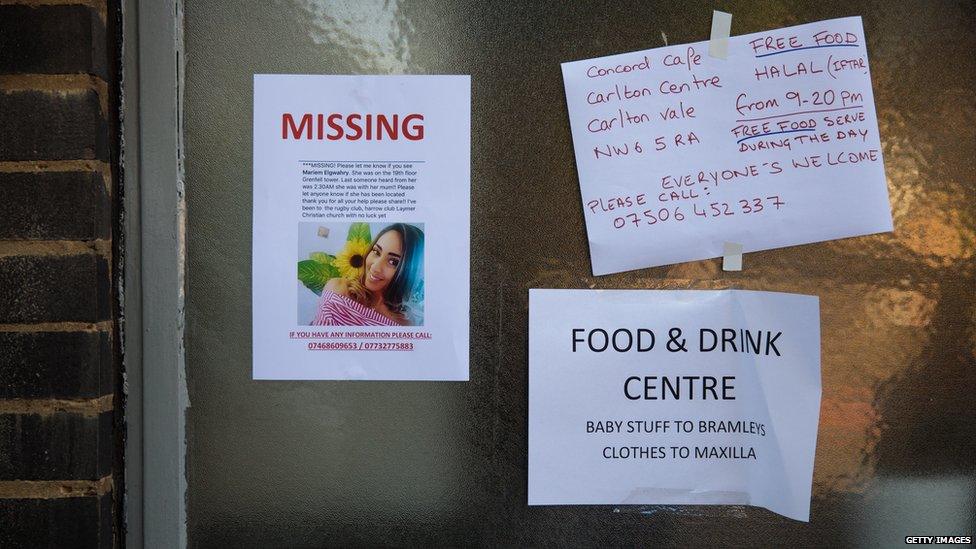 A missing persons poster sits on a community centre near to the site of the Grenfell Tower fire