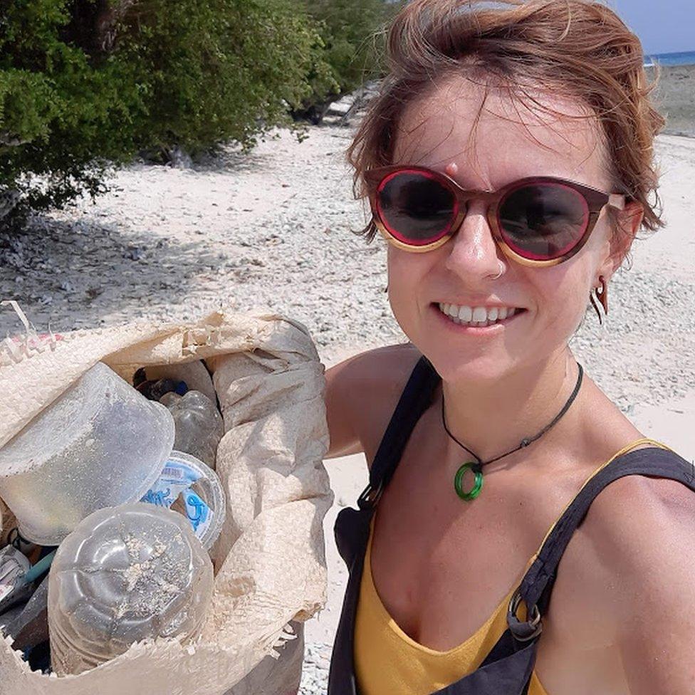 Sian collecting rubbish.