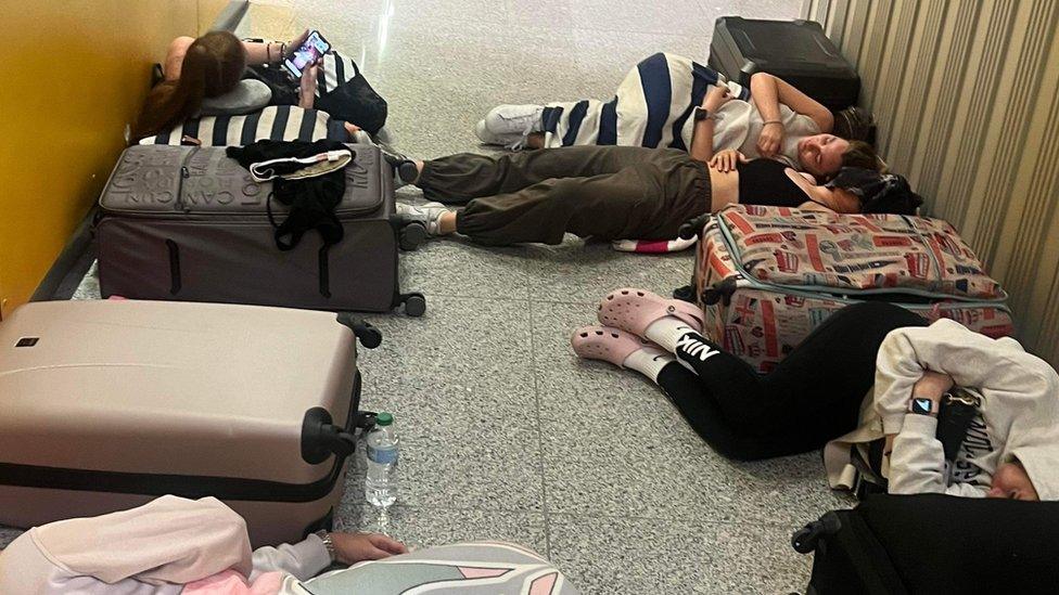 Jayne and her friends sleeping on the floor of Ibiza airport