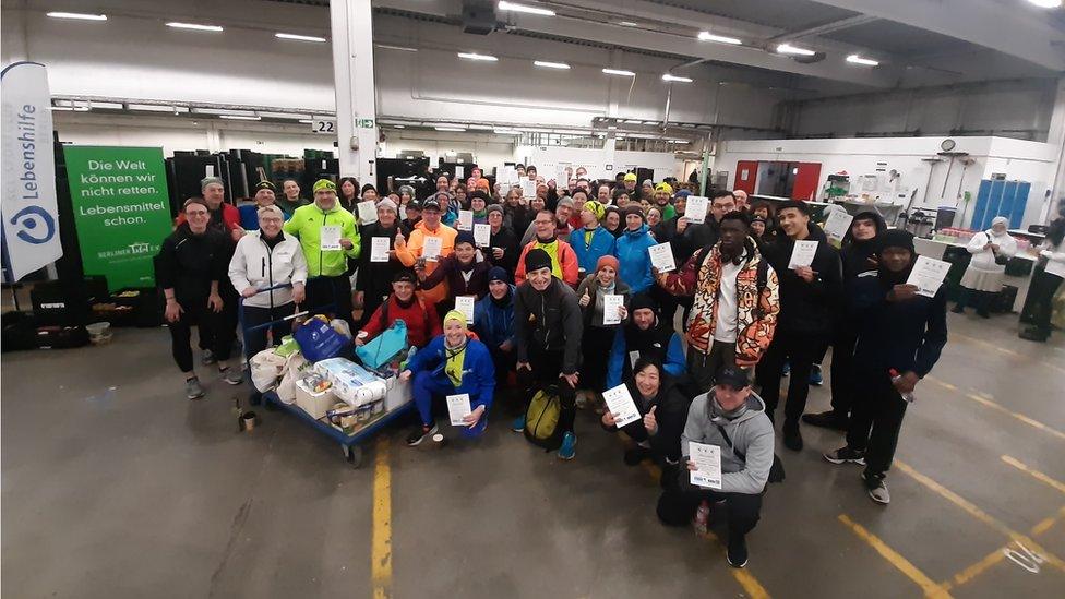 Runners in Berlin having dropped off their food bank donations