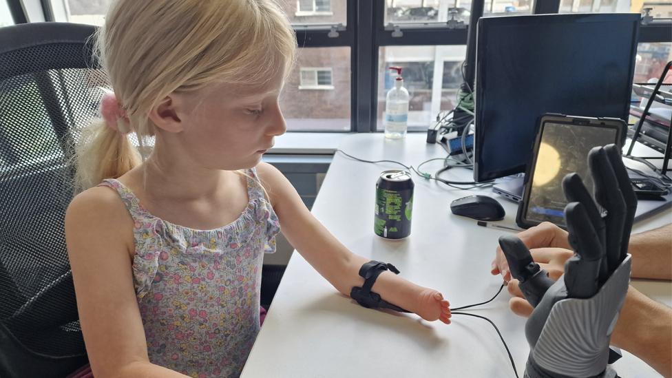 Caitlin with her arm being fitted for the bionic limb.