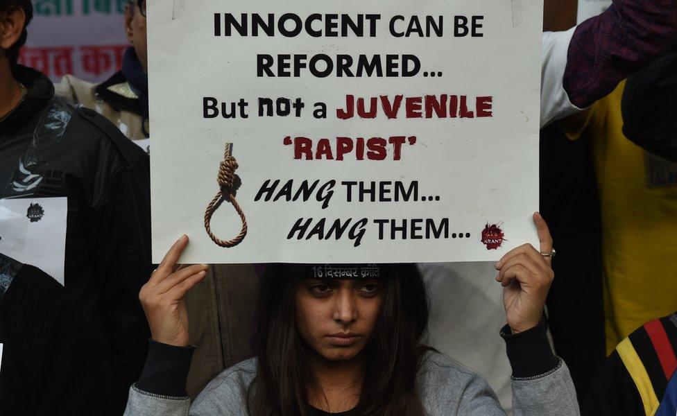 An Indian protester holds a placard during a demonstration against the release of a juvenile rapist in New Delhi on December 21, 2015. India's Supreme Court December 21, 2015 rejected an appeal against the release of the youngest convict in an infamous fatal gang-rape, sparking fury from the victim's parents who said the ruling was a betrayal of women.