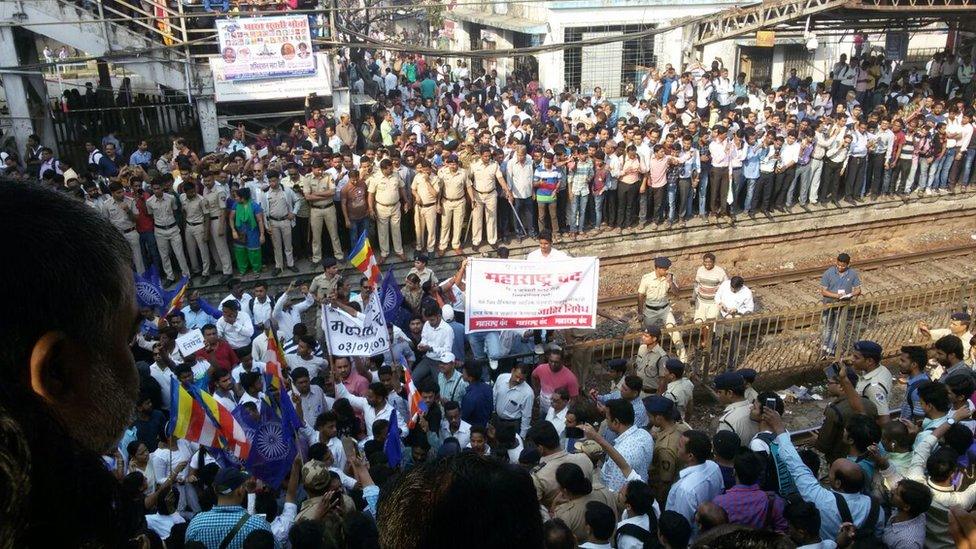 Thousands of protesters from India's low-caste Dalit community disrupted key transport services in Mumbai.