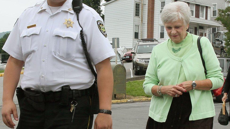 Dorothy Sandusky (R), wife former Penn State assistant football coach Jerry Sandusky, goes to court in Bellefonte, Pennsylvania, in June 2012