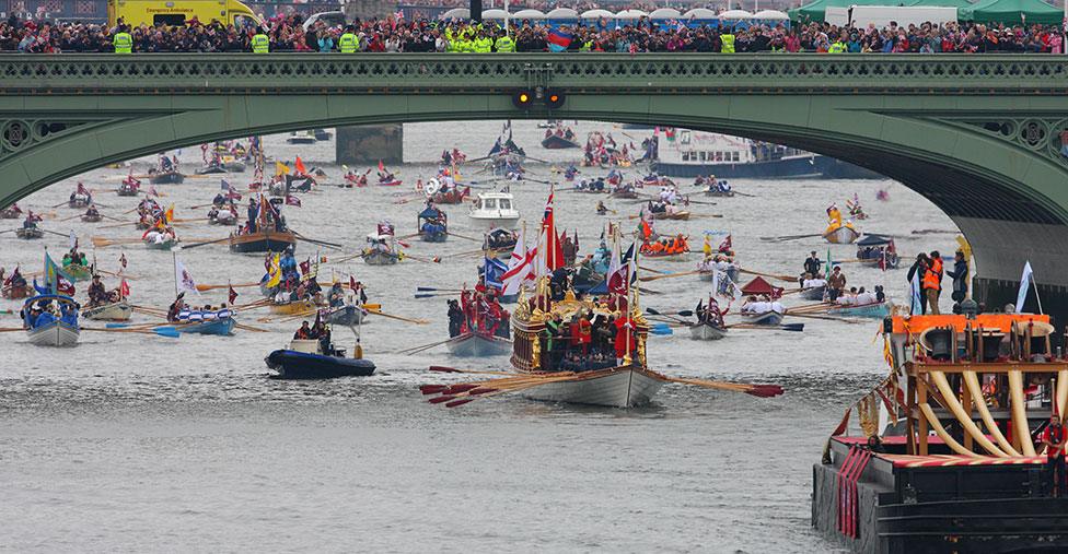 Gloriana - Her Majesty's Royal Barge heads the historic flotilla of 1,000 boats along the Thames river in June 2012