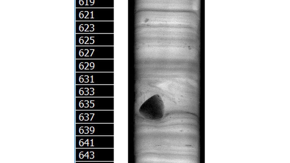 Core 033 with scale and dropstone which has fallen from iceberg.jpg