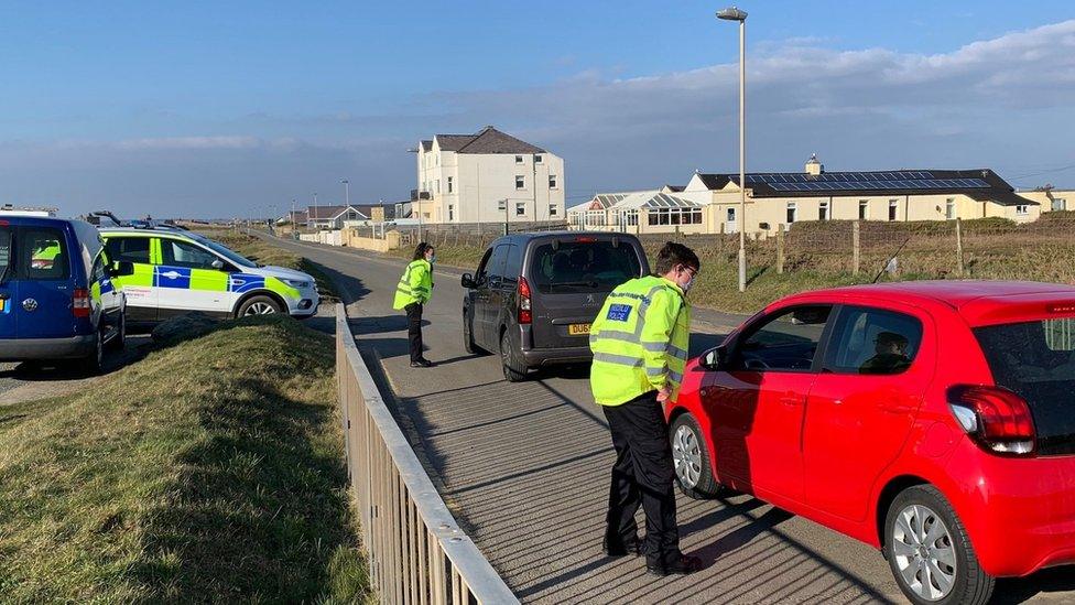 Police officer speaks to motorist