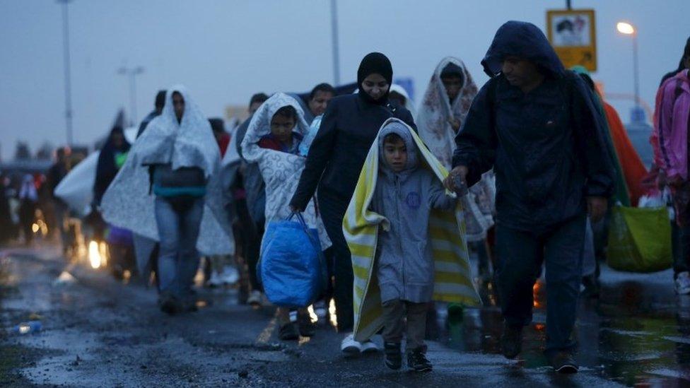 Migrants arrive at the Austrian-Hungarian border, 5 September 2015