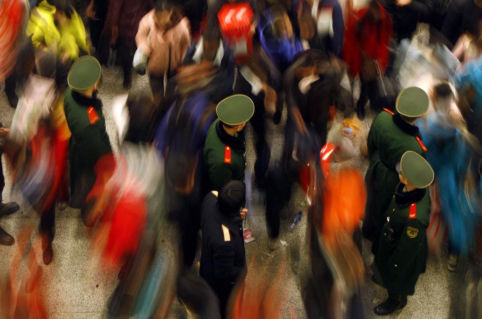 a shot of the very busy Wuhan bus station in 2009