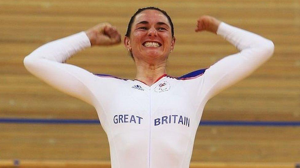 Sarah Storey celebrates on the podium at the velodrome at the Beijing 2008 Paralympics