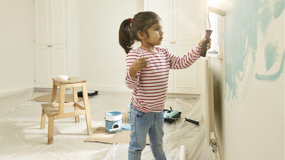 Gil painting her bedroom