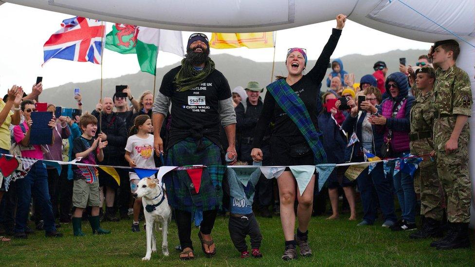 Chris Lewis crossed the line with fiancee Kate Barron, baby Magnus and their pet dog, Jet