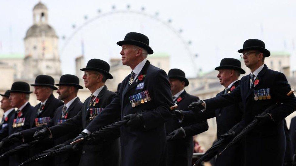 Veteran soldiers walk on Horse Guards Parade after the National Service of Remembrance at the Cenotaph in Westminster, London