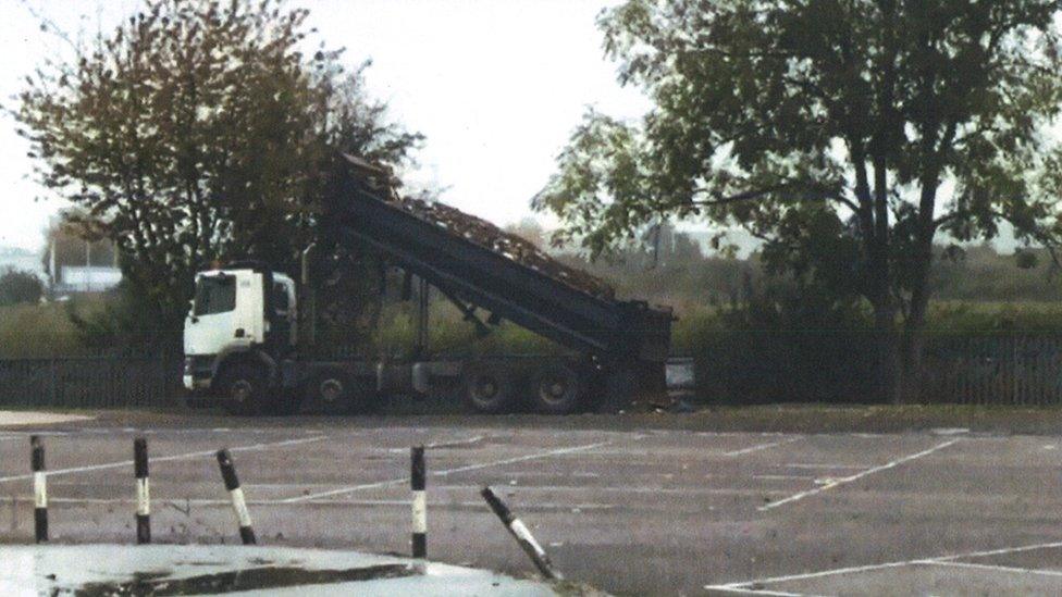 A tipper truck dumping waste