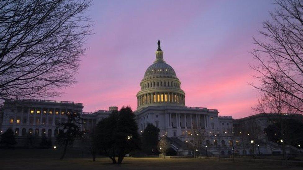 The US Capitol dome at sunrise.