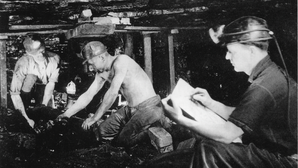 Photo showing Henry Moore sketching working coalminers at Wheldale Colliery in 1942