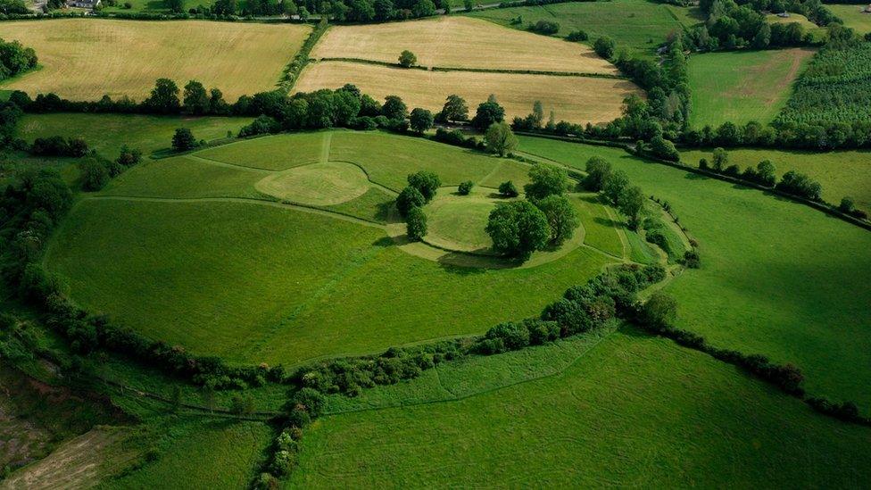 Navan Fort is a circular earthwork on top of a drumlin which was a significant religious site in the Iron Age