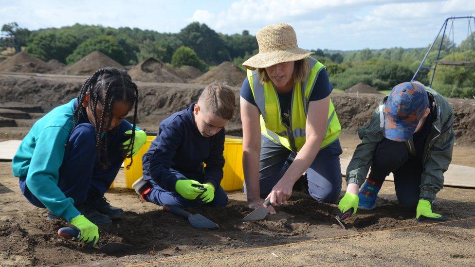 Children from Rendlesham Primary School excavating pits