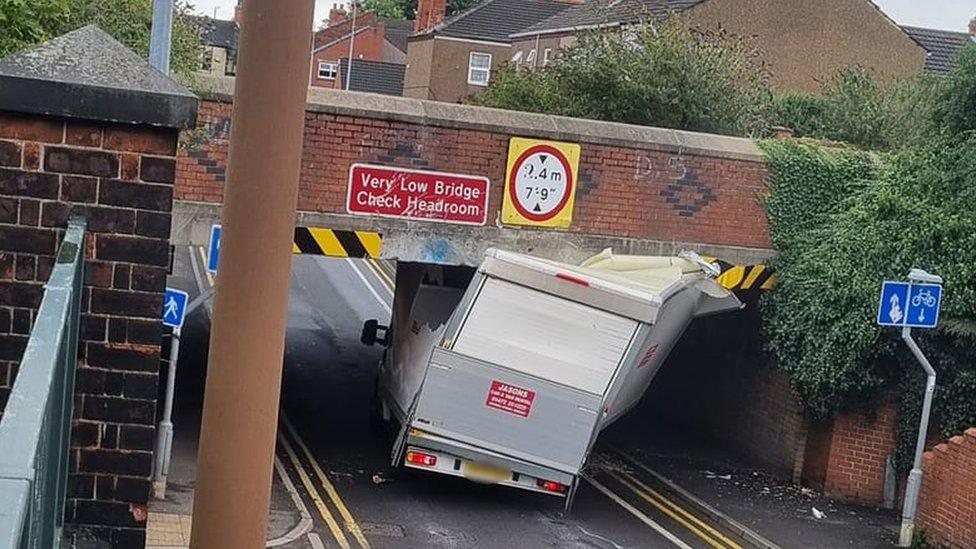 Luton van stuck under road bridge