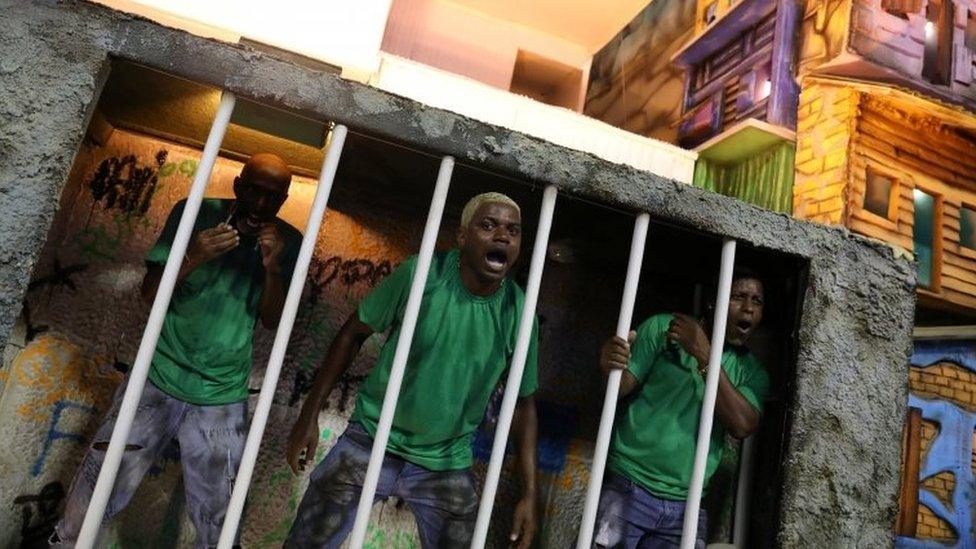 Performers dressed as prisoners at Rio Carnival