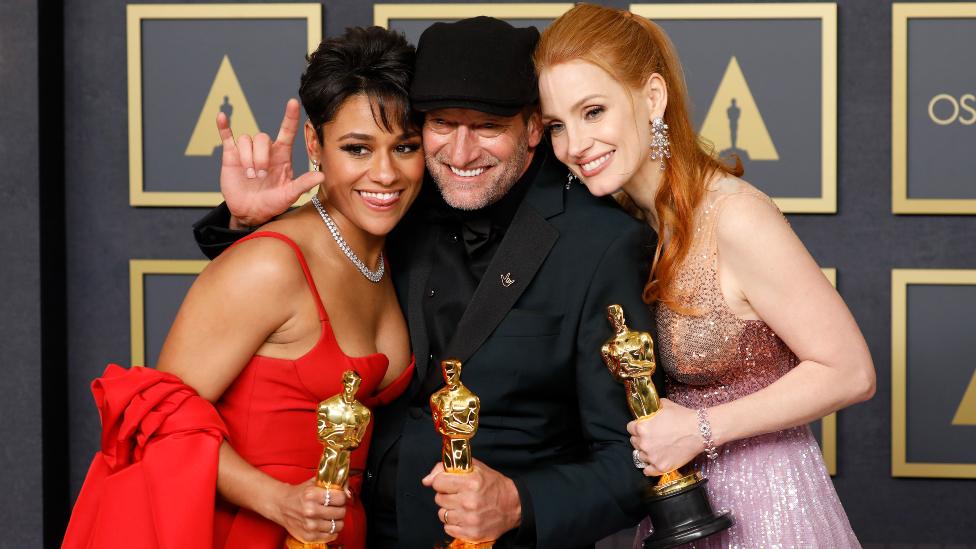 Ariana DeBose, Troy Kotsur and Jessica Chastain at the Oscars 2022