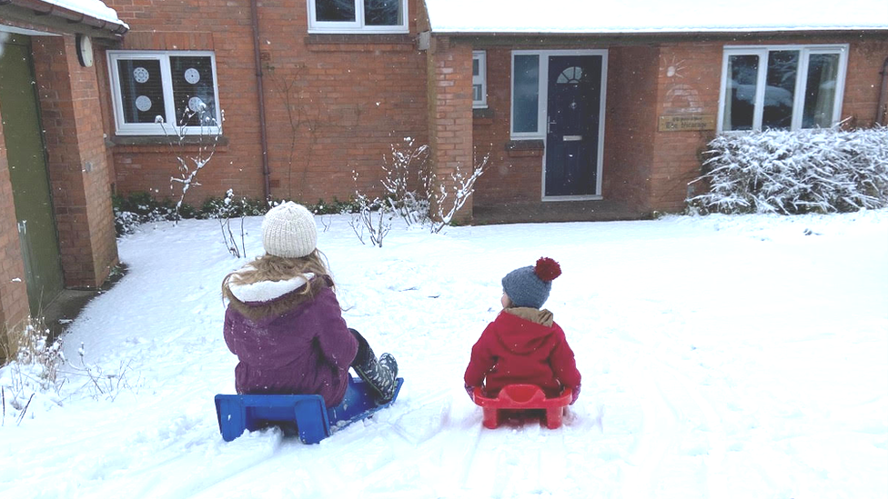 Two children sledging