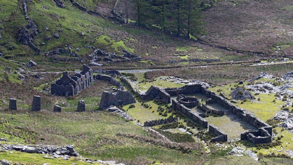 Photo of ruined miners' cottages