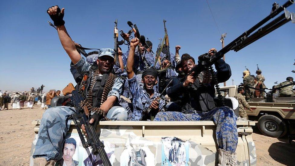 Newly recruited Houthi fighters chant slogans as they ride a military vehicle in Sanaa on 3 January 2017