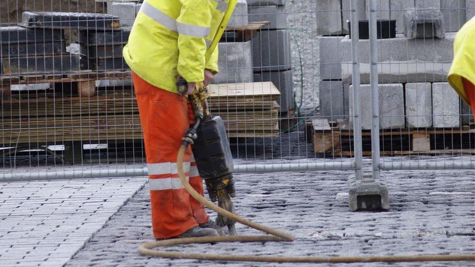 Man drilling road