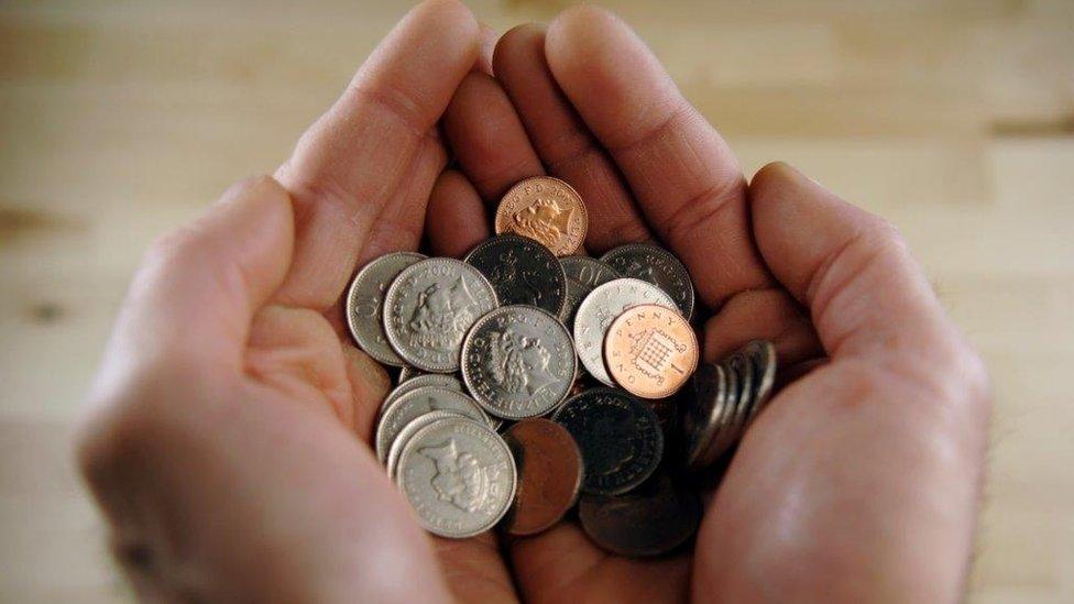 Hands with coins