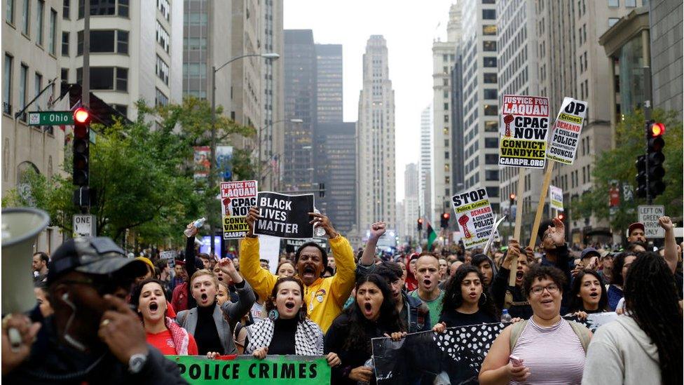 Demonstrators protest as they celebrate the verdict in the murder trial of Chicago police officer Jason Van Dyke along Michigan Avenue on October 5, 2018 in Chicago, Illinois