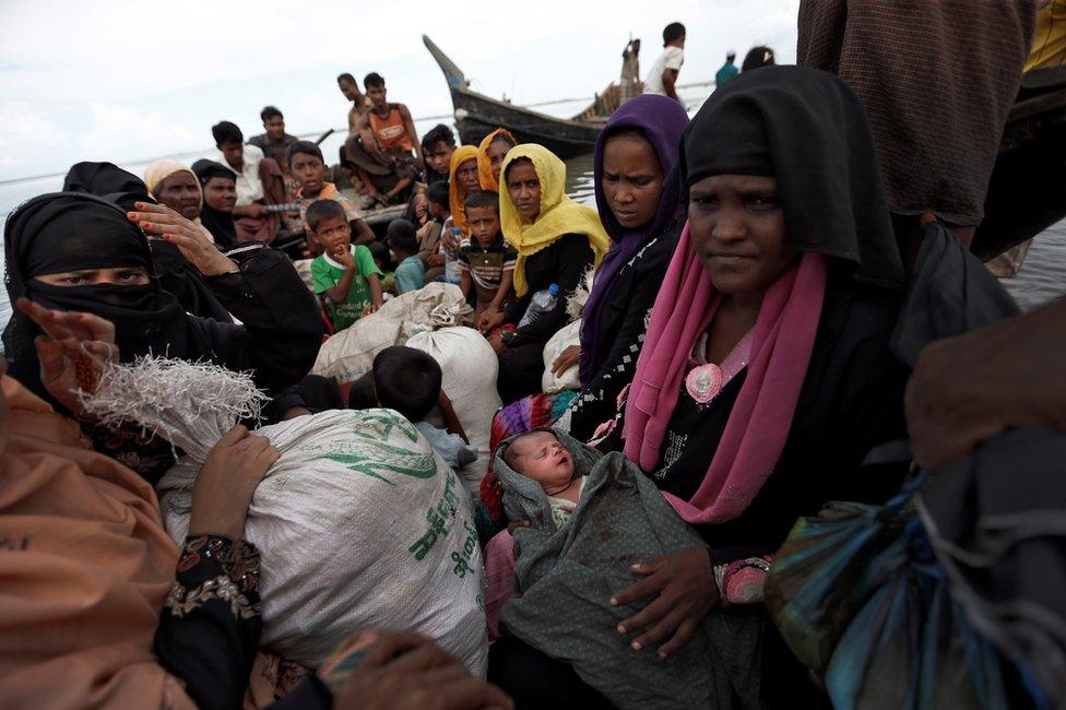 Newly arrived Rohingya refugees board a boat as they transfer to a camp in Cox's Bazar, Bangladesh, 2 October 2017.