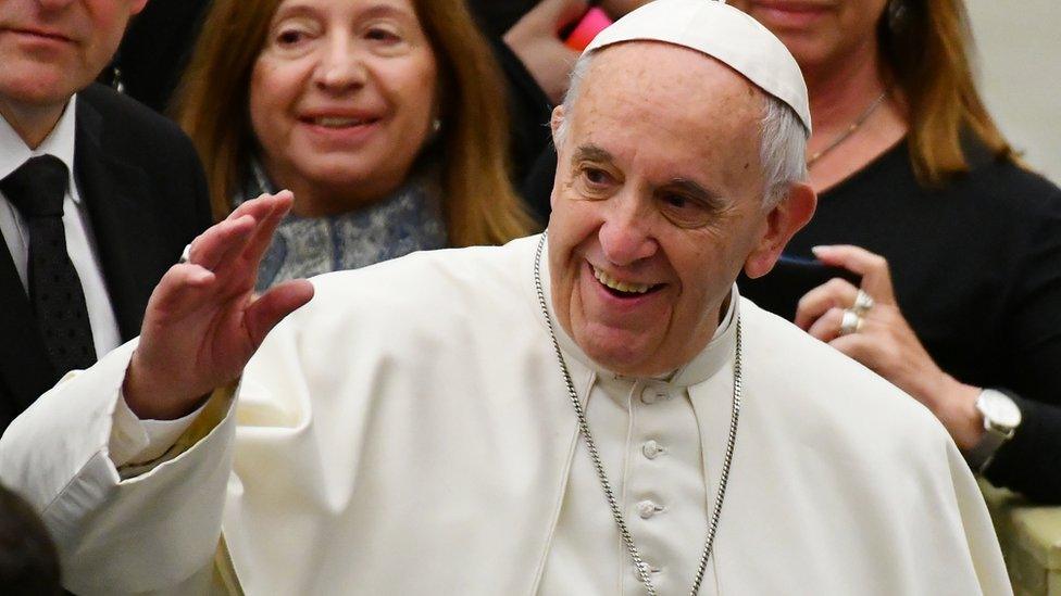 Pope Francis greets the crowd during his weekly general audience at the Paul VI audience Hall on 7 December 2016 at the Vatican