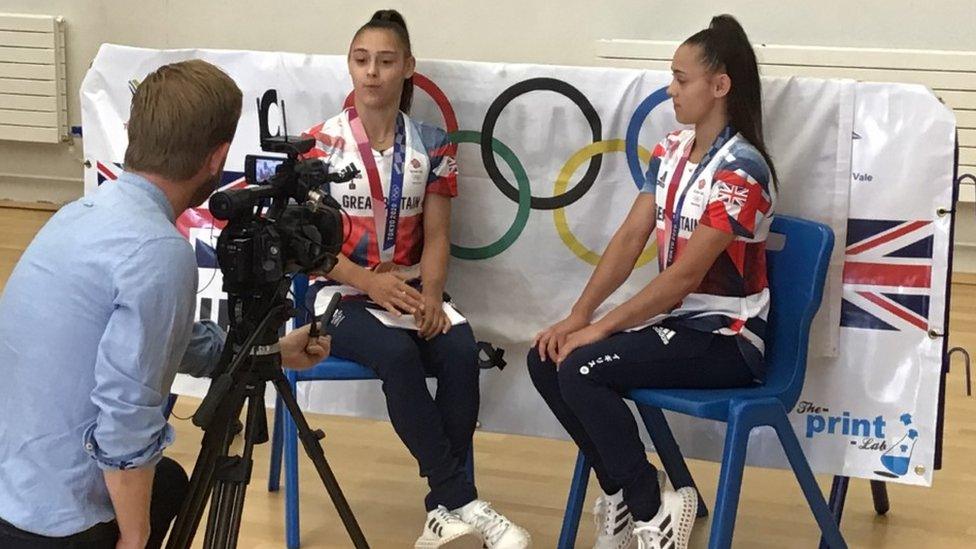 Jessica (left) and Jennifer Gadirova with the press