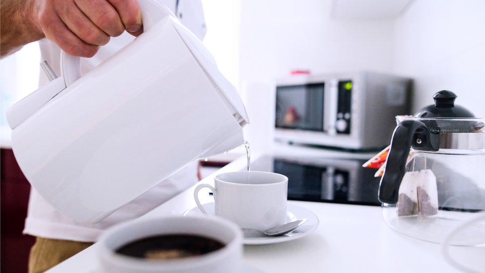 Man pouring kettle