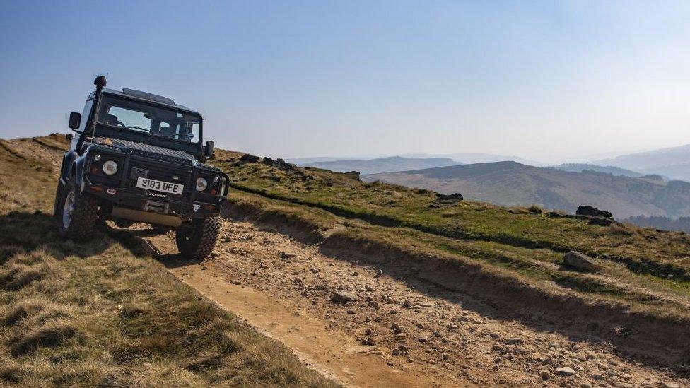 Landrover Defender on Stanage Edge