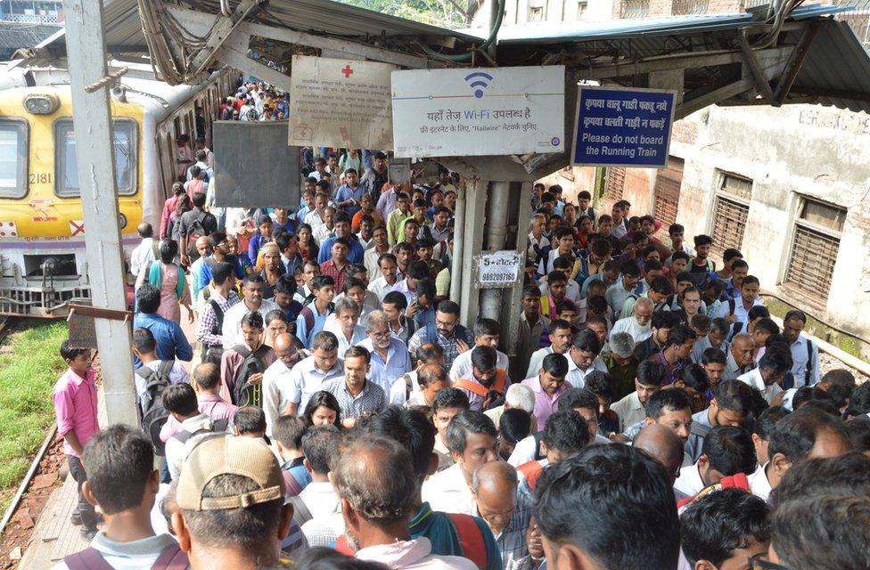 A crowd at a local Mumbai train station