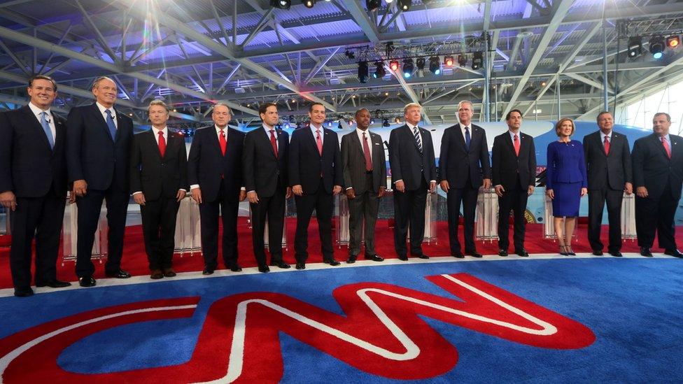 The eleven presidential candidates stand on the stage at the second Republican debate,