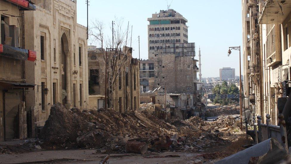 Rubble from damaged buildings in the street, 3 November 2016