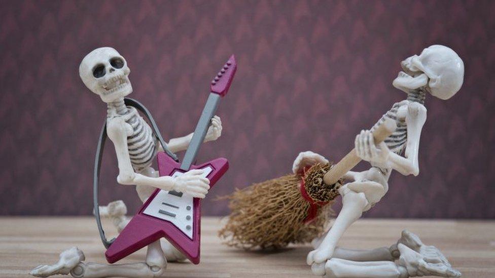 skeletons playing guitar