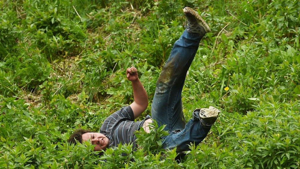 Cheese rolling on Cooper's Hill at Brockworth, Gloucestershire