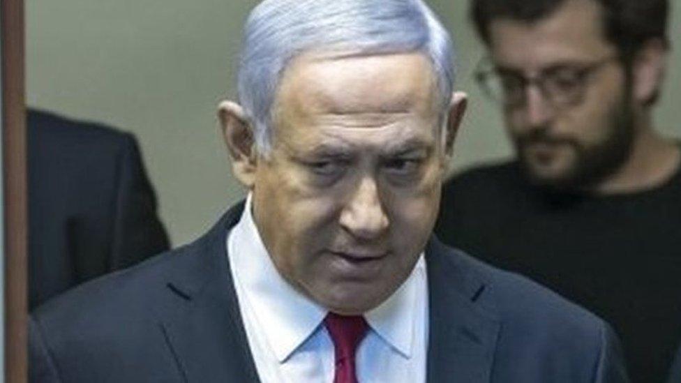 Prime Minister Benjamin Netanyahu (L) walking into a press room to make a statement to the press, in his Jerusalem offices, 28 February 2019.