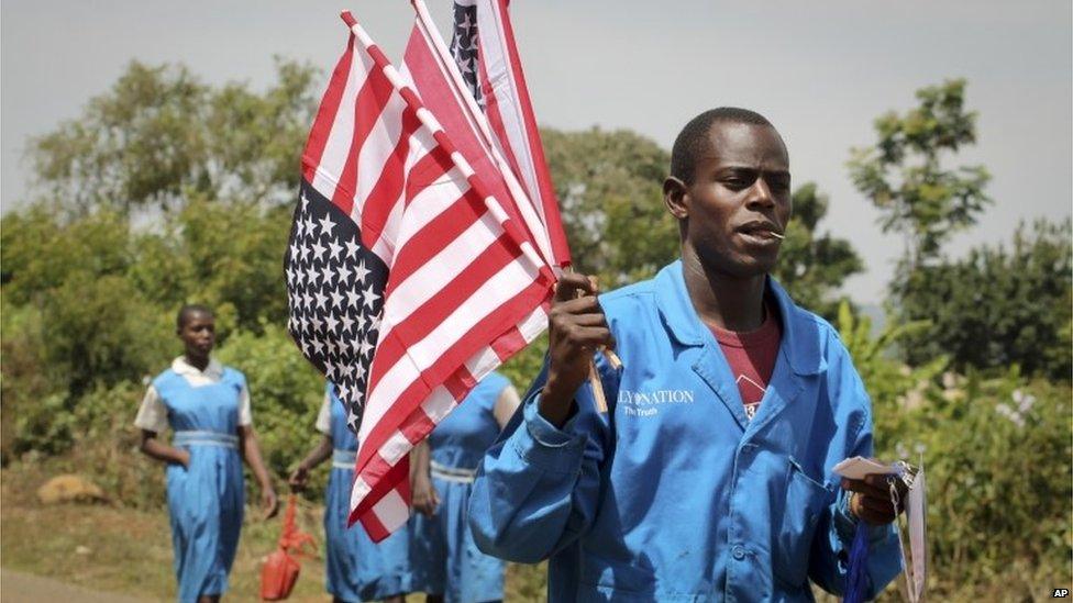 A vendor sells American flags at an event attended by Sarah Obama