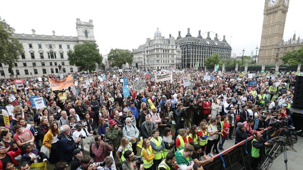 Protesters hold a 'Refugees Welcome' march in Parliament Square