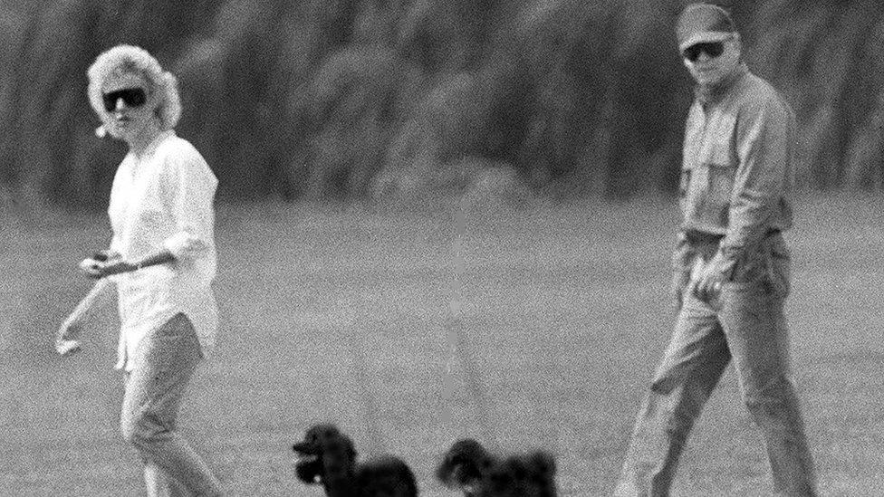 Bulger and his girlfriend Catherine Greig walk together with two dogs in Boston in 1998